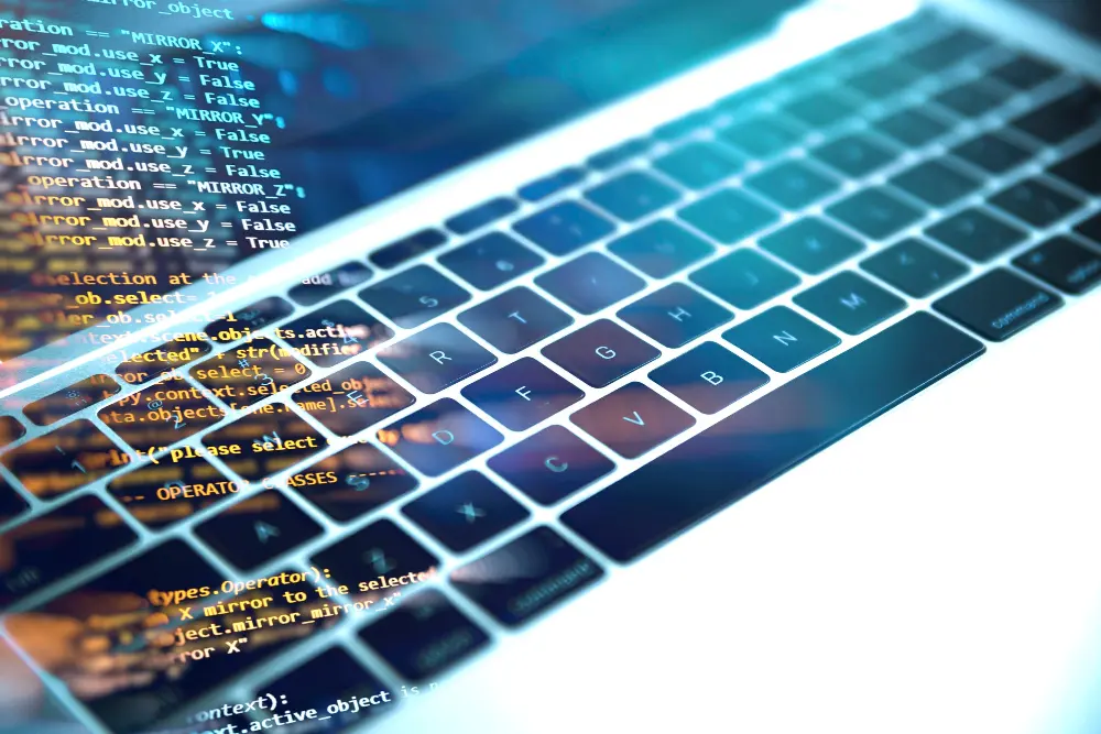 kod html a w tle klawiatura od laptopa